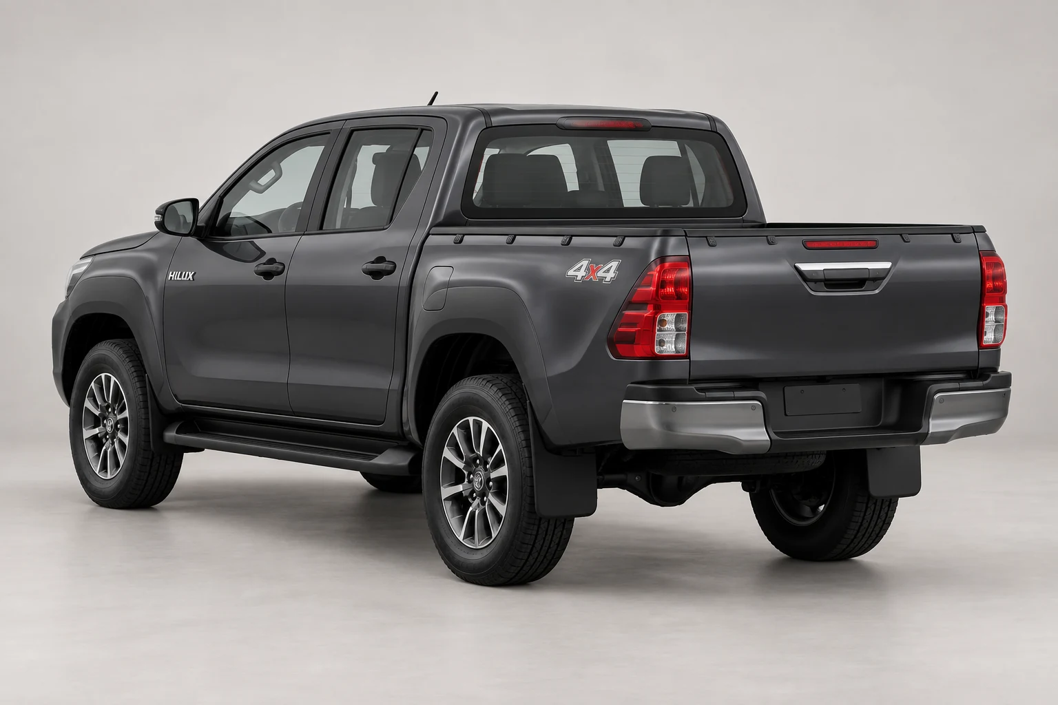 Ilustrasi Hilux DC 4x4 dari sudut belakang tiga perempat